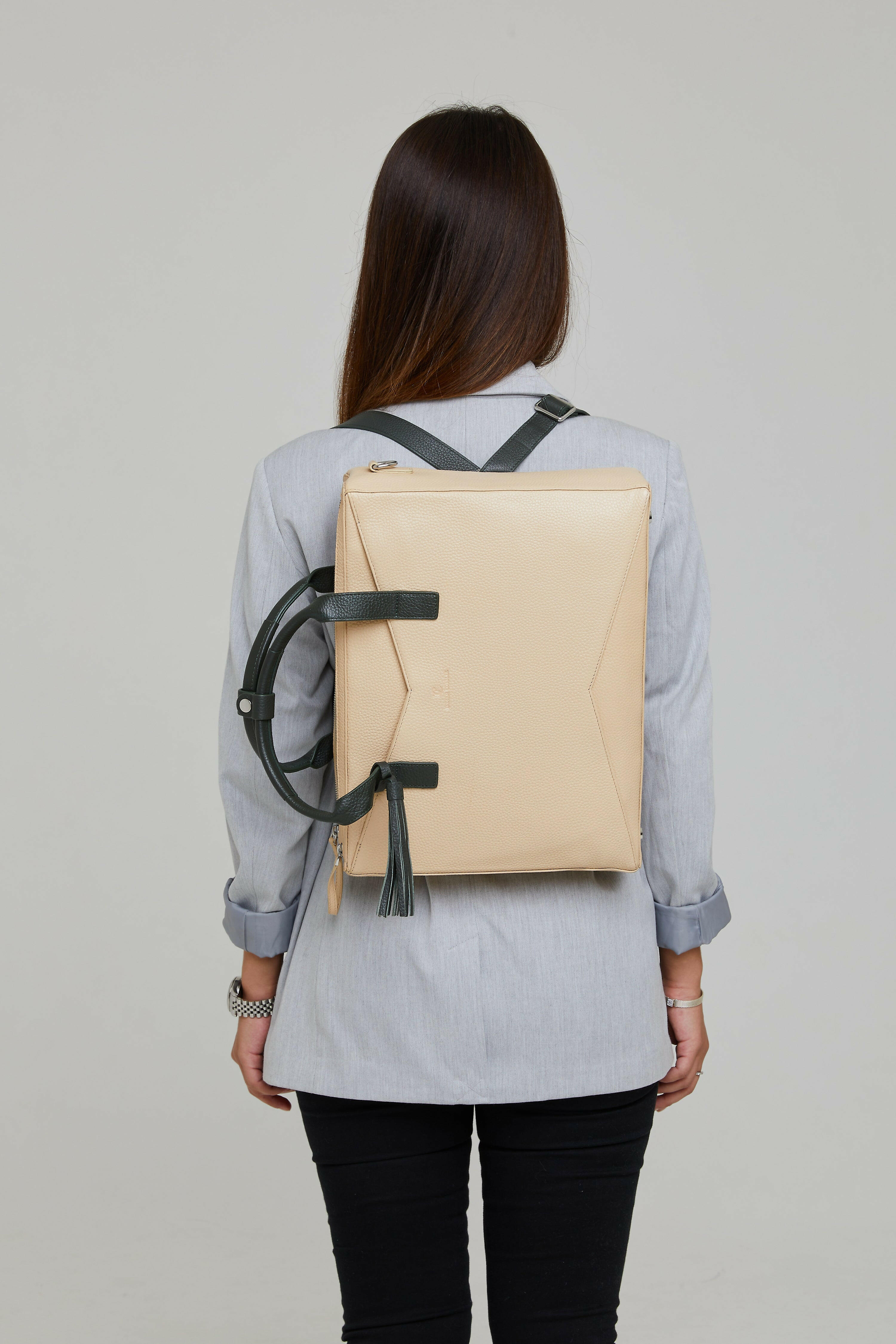 Bina office bag could be wear as backpack and carry with trolly bag handle thanks to its loads of features
